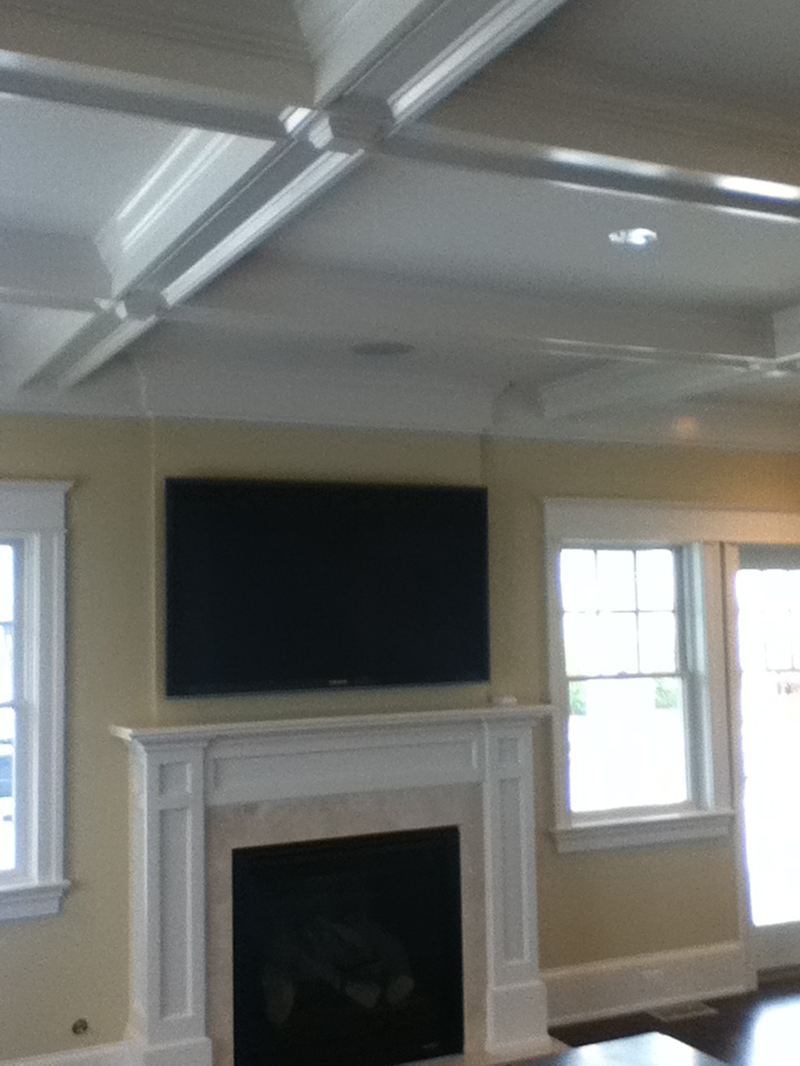 Custom coffered ceiling and fireplace surround