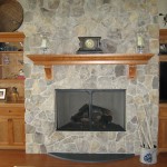 Custom stone fireplace with cherry mantle